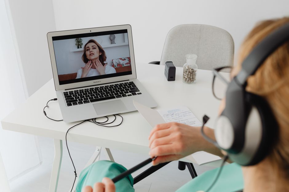A healthcare professional on a video call showing how does telehealth work and is it covered by insurance for patients at home